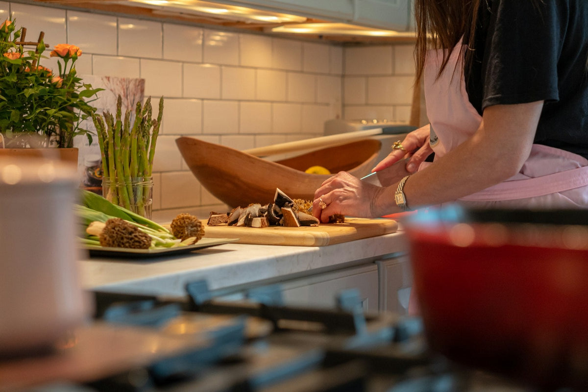 Chopping fresh vegetables in a modern kitchen